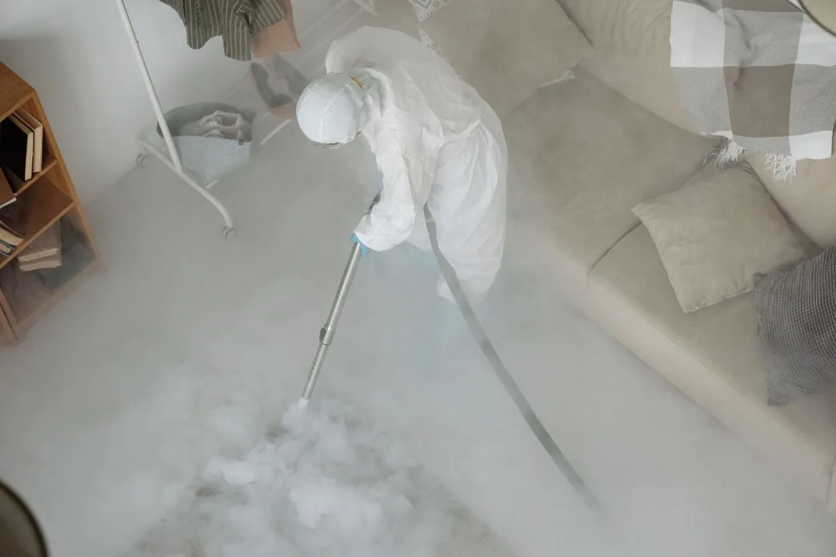 Biohazard cleanup technician in protective equipment, Gunter, TX